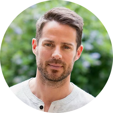 A smiling man with dark hair